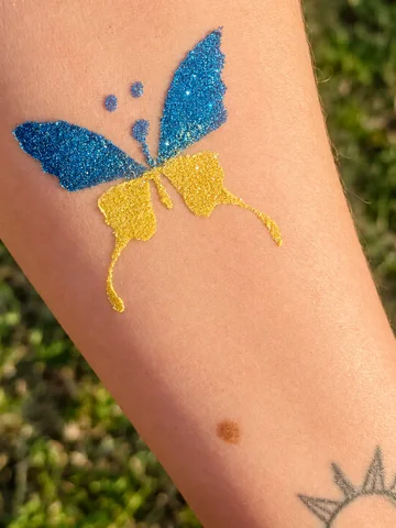 Mariposa de glitter azul y amarillo