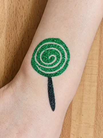 Piruleta en espiral de glitter verde